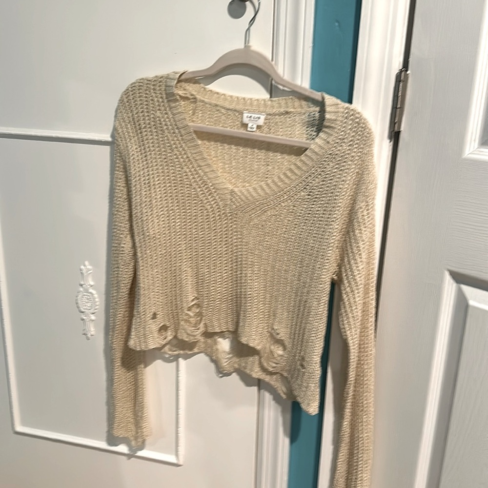 Lelis Collection cropped sweater. Super cute rips on the bottom and on sleeves.